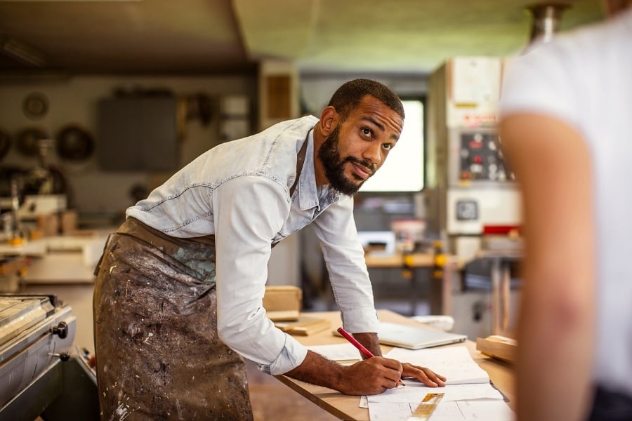 Man building more than his business. Man building more than his business.